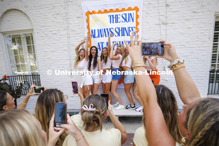 New Alpha Phi recruits are photographed by their big sisters outside their house. Sorority Recruitment Bid Day. August 24, 2024. Photo by Craig Chandler / University Communication and Marketing.